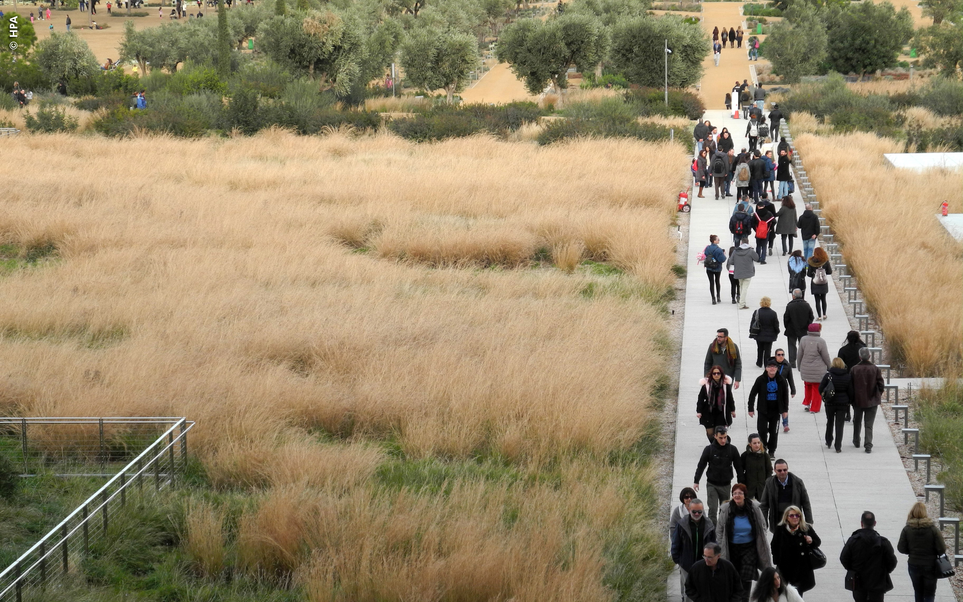 Large number of people strolling on a roof garden